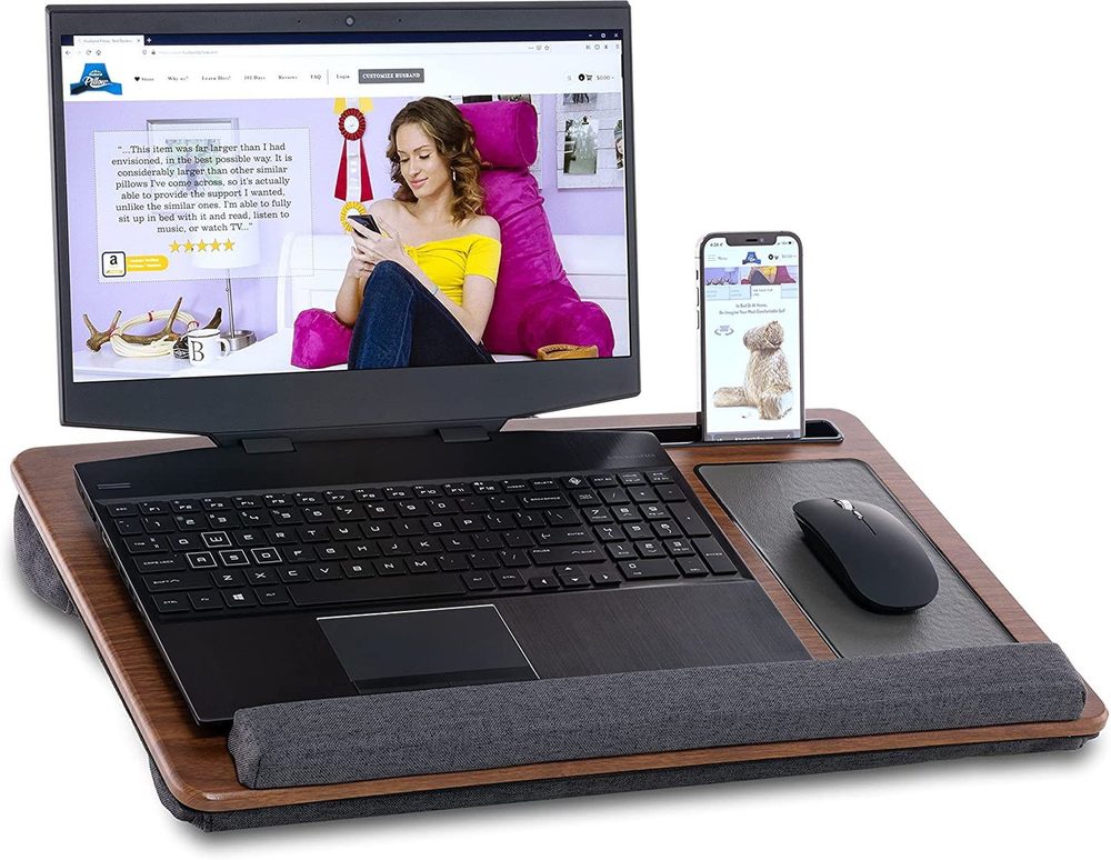 Lap desk with laptop, phone and mouse on a sofa