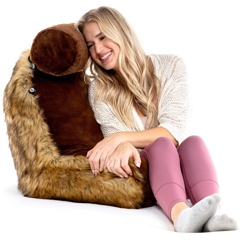 Woman hugging a plush faux-fur reading pillow