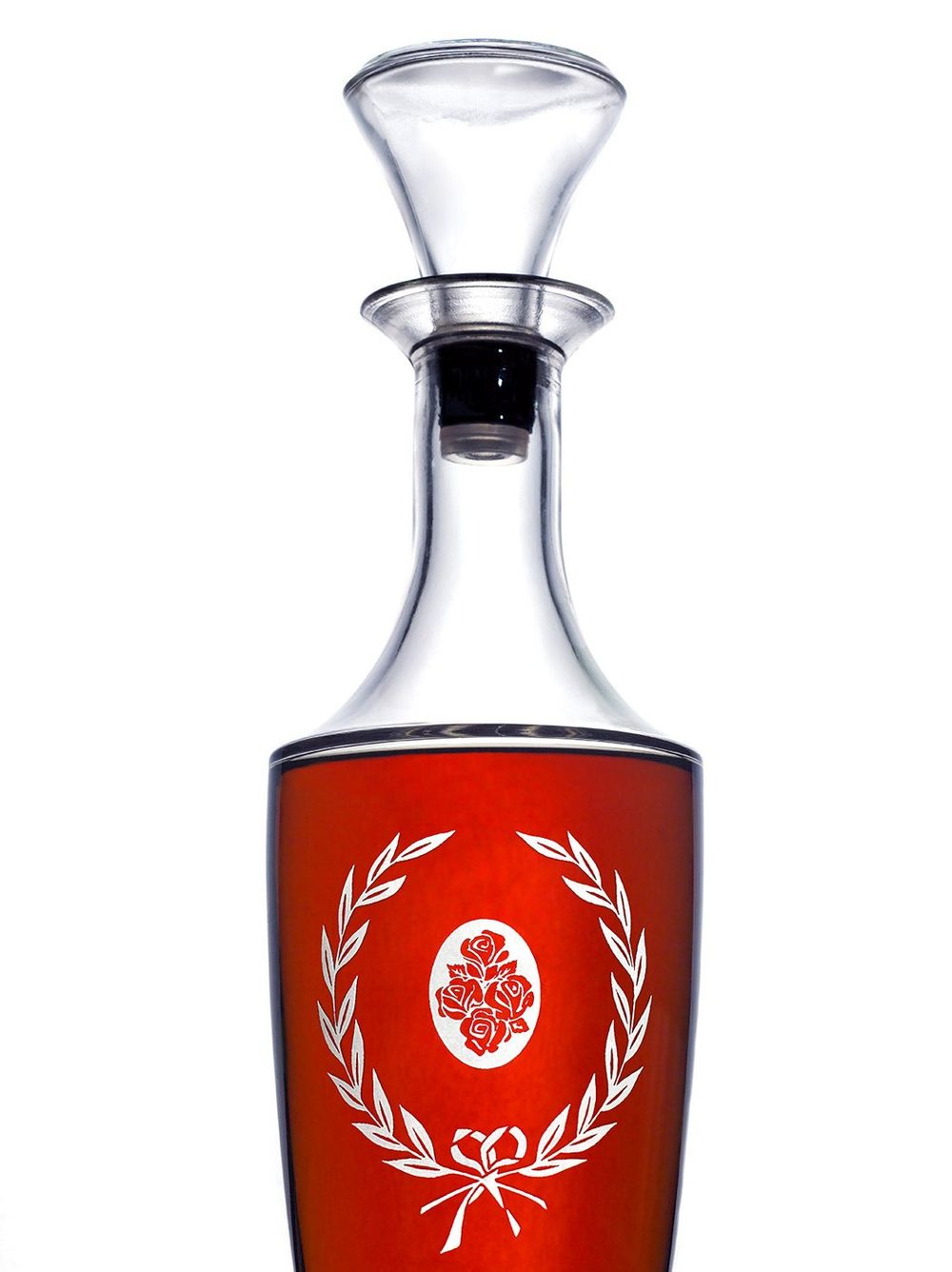 Glass decanter with a red label on white