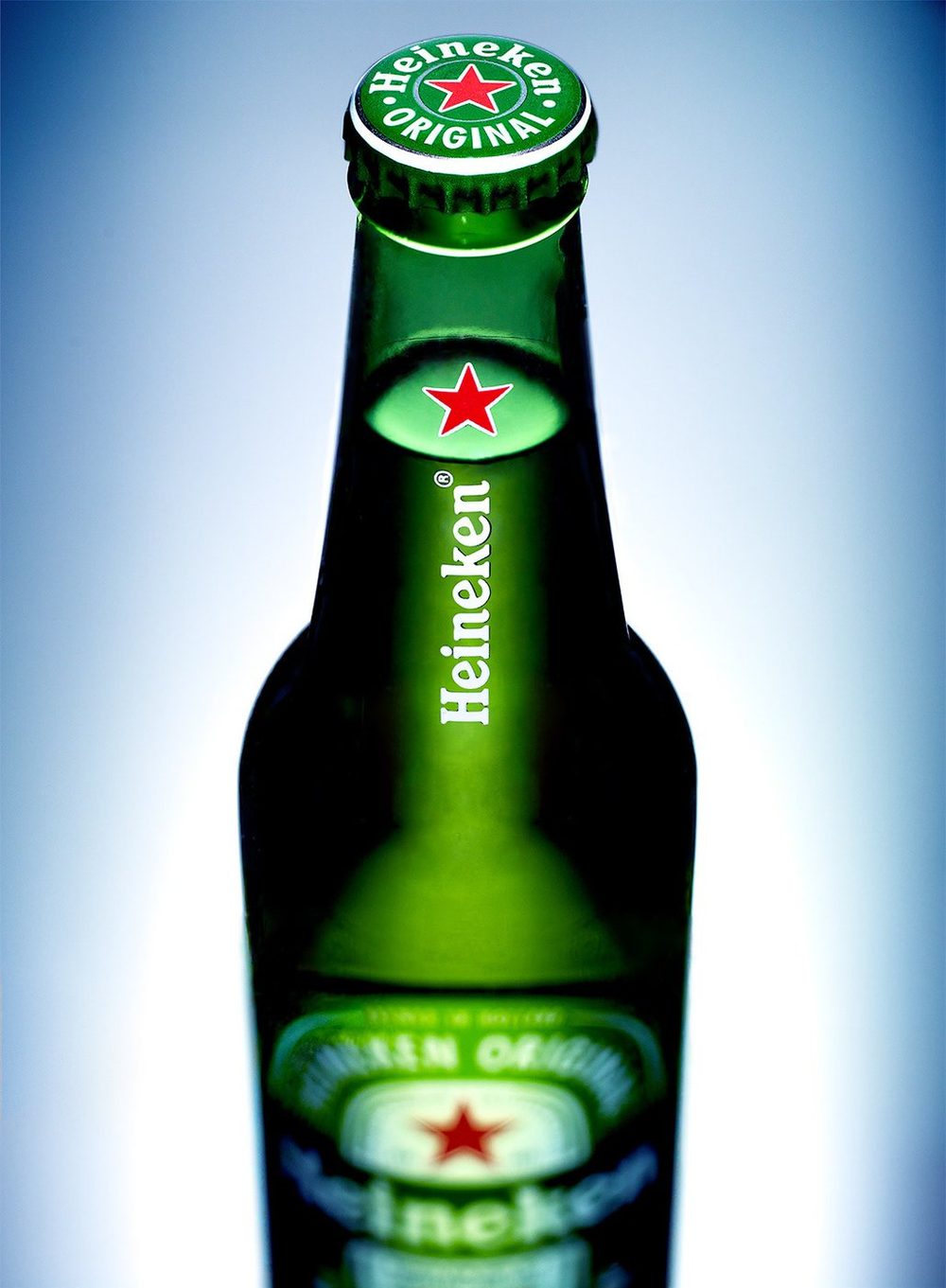 Heineken bottle on a blue gradient
