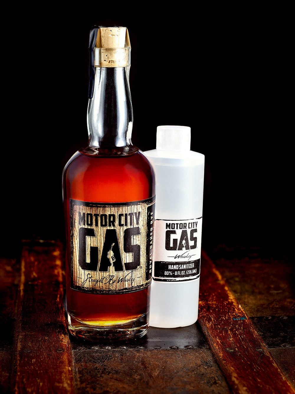 Motor City Gas whiskey bottles on black