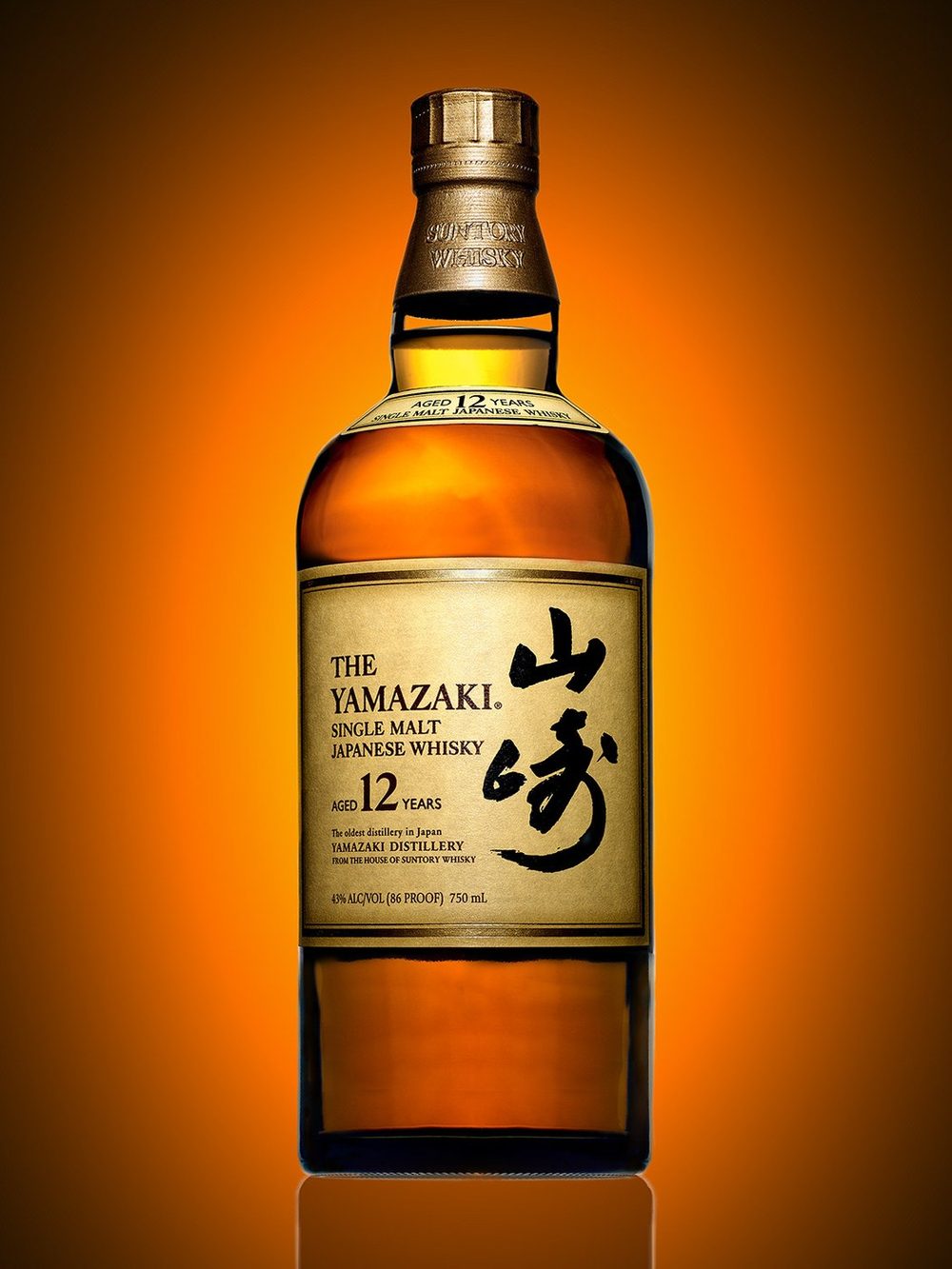 Yamazaki 12 year whisky bottle on a warm gradient